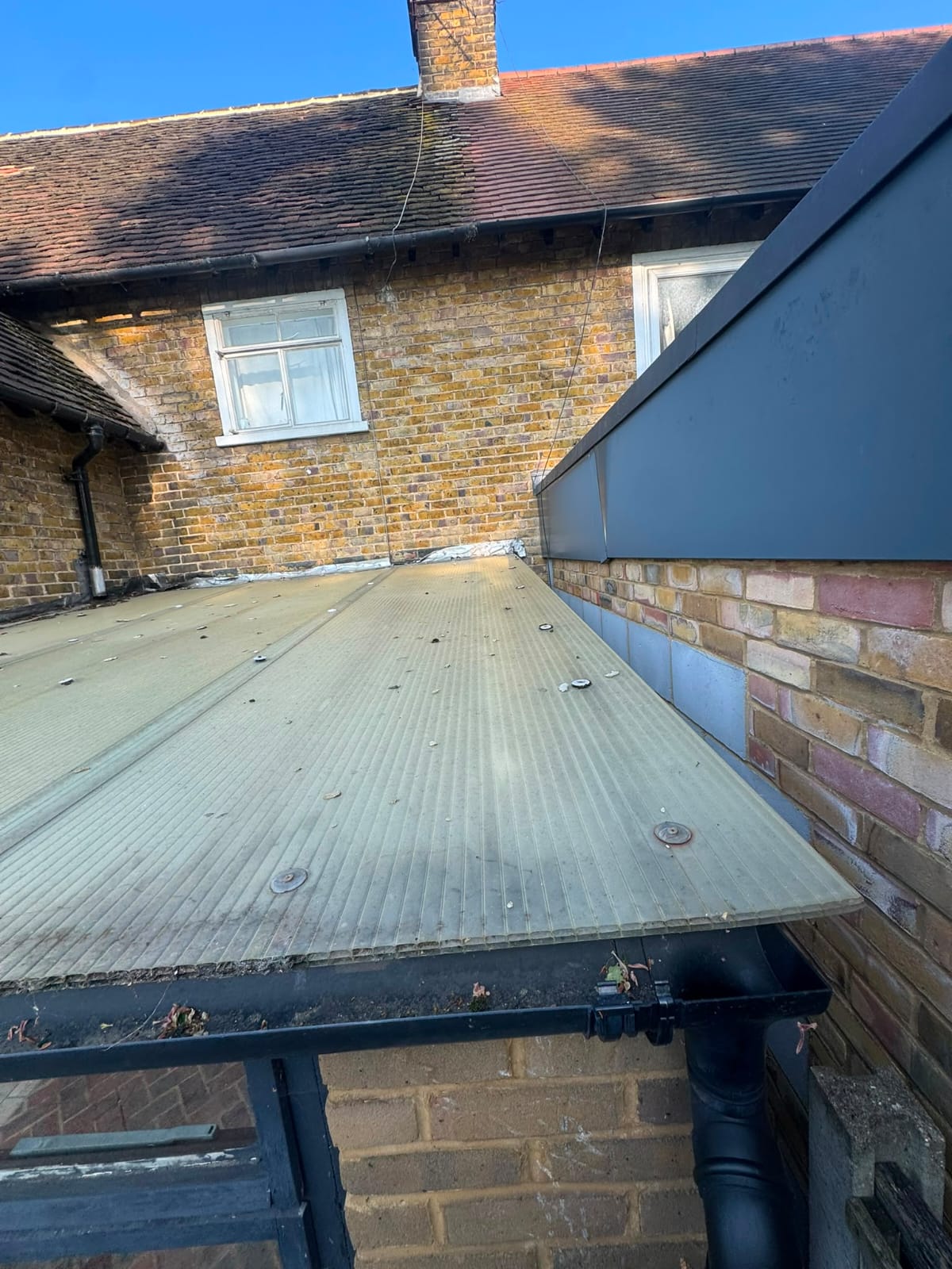 Outbuilding roof covering due for removal and replacement in North Wales