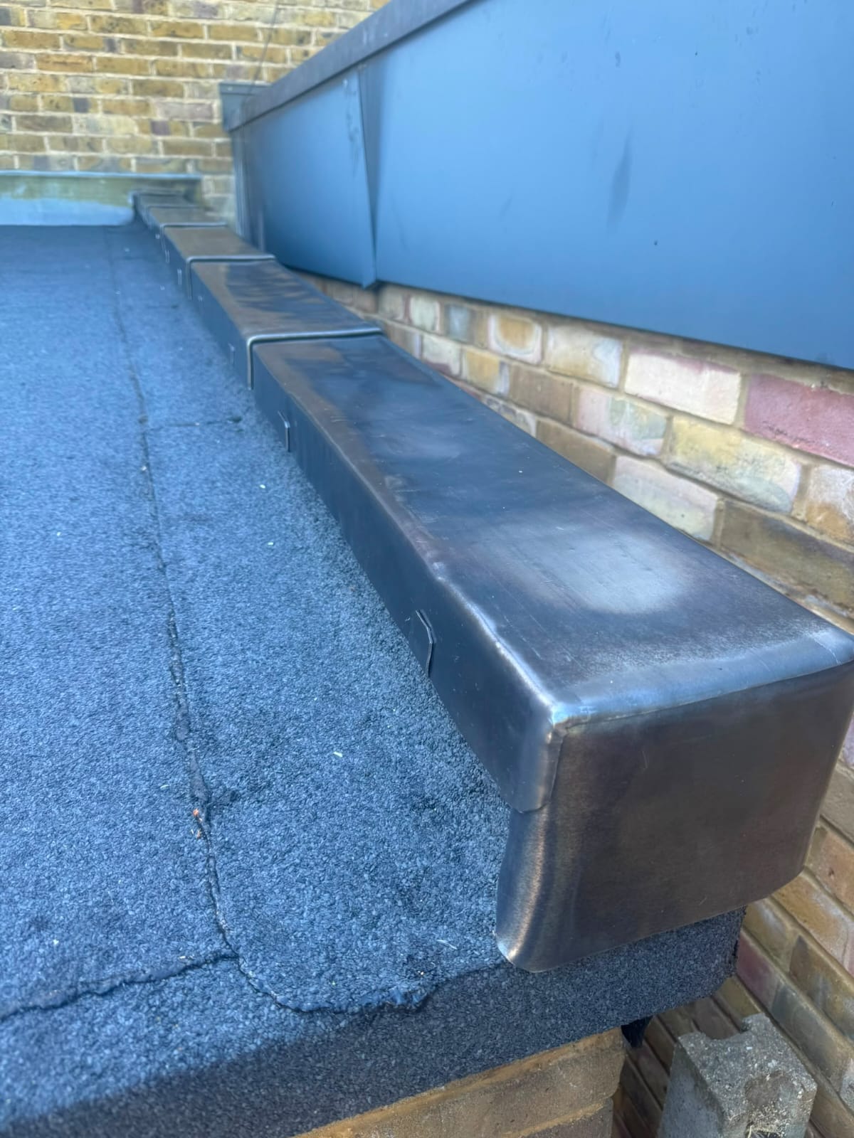 Finished lead flashing and lead valley work on a slate roof