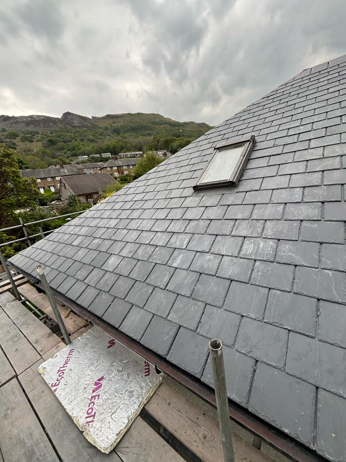 Velux roof window fitted and flashed into a natural slate roof in North Wales