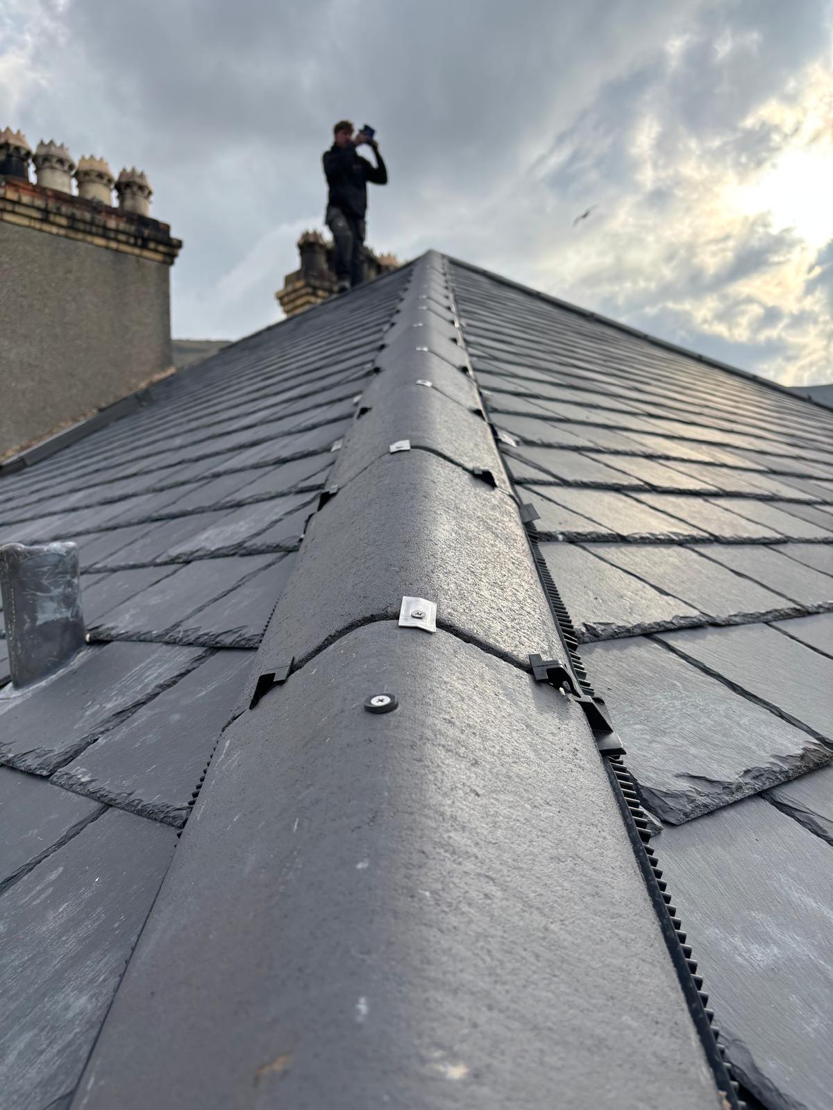 Natural slate roof with clipped ridge detail on a North Wales property