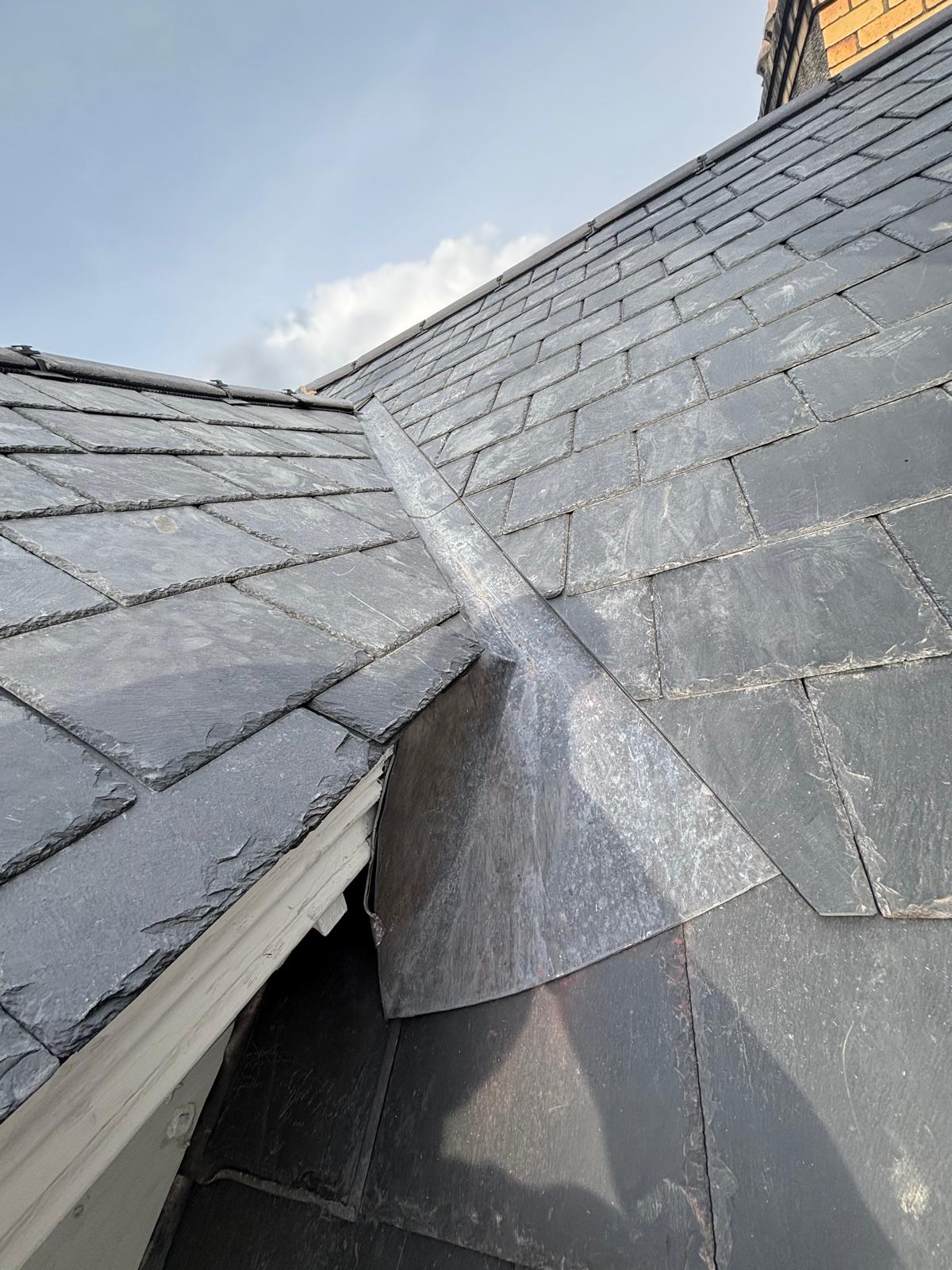 Finished lead flashing and lead valley work on a slate roof